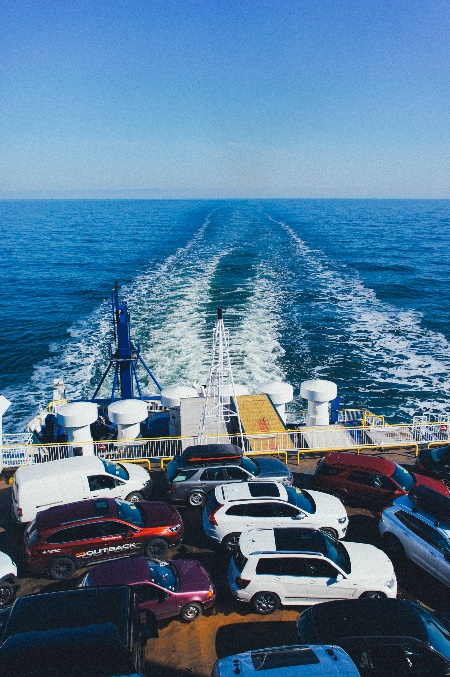Cars being shipped by boat in the ocean