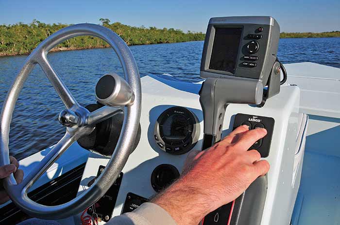 A person driving a boat

Description automatically generated with low confidence