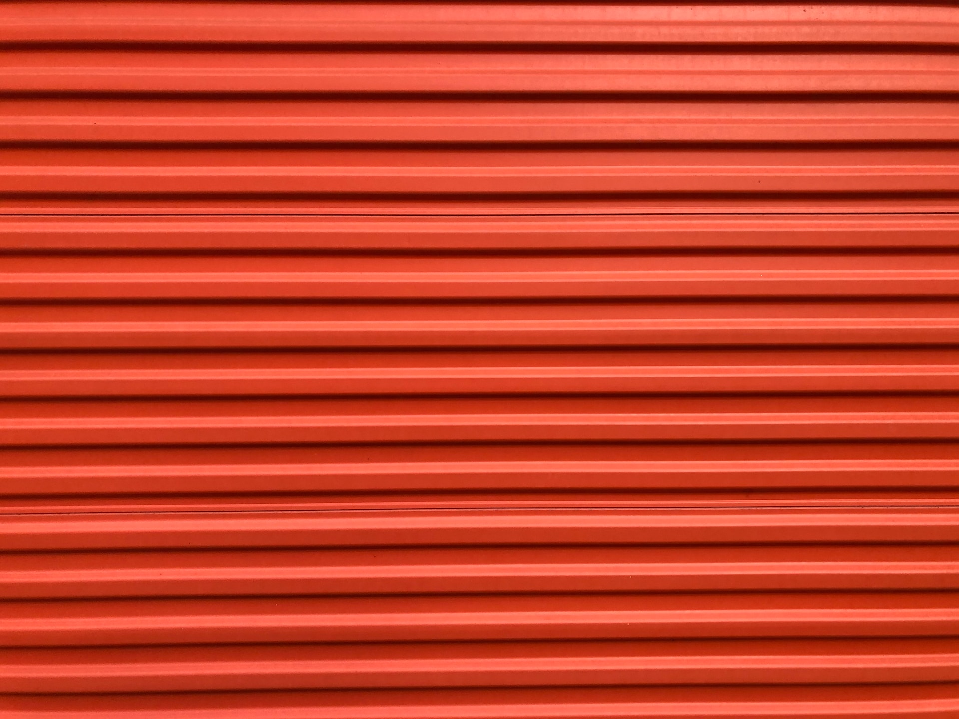 an orange storage unit roll-up door