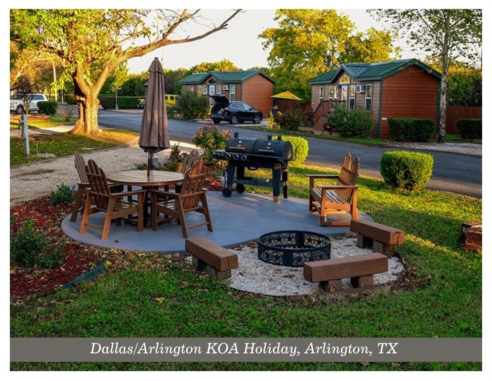 Picture of the Dallas / Arlington KOA with a BBQ, Firepit, picnic table, and chairs.
