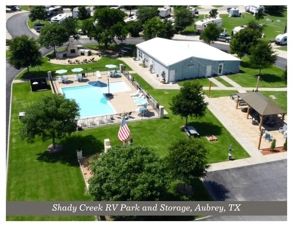 Swimming pool area with clubhouse at the Shady Creek RV Park and Storage in Aubrey Texas.