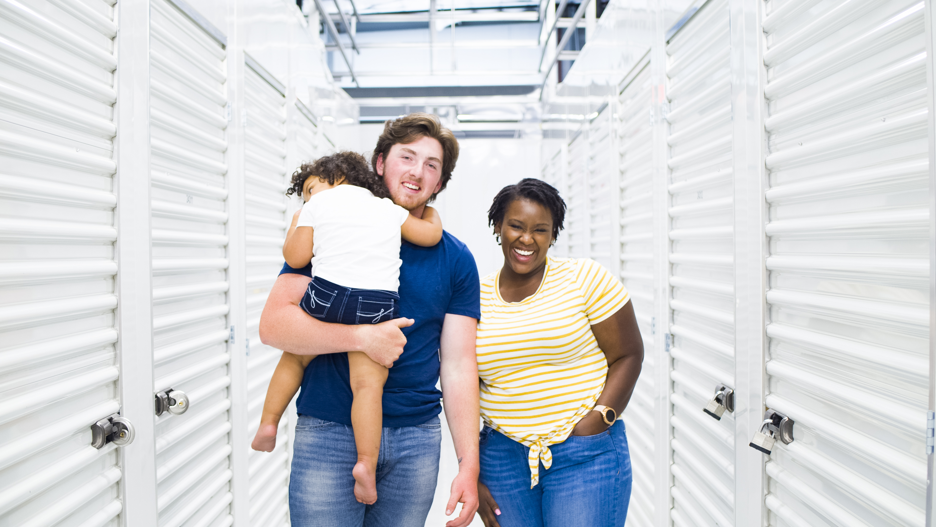 A family moving into a storage unit at STORExpress Turtle Creek