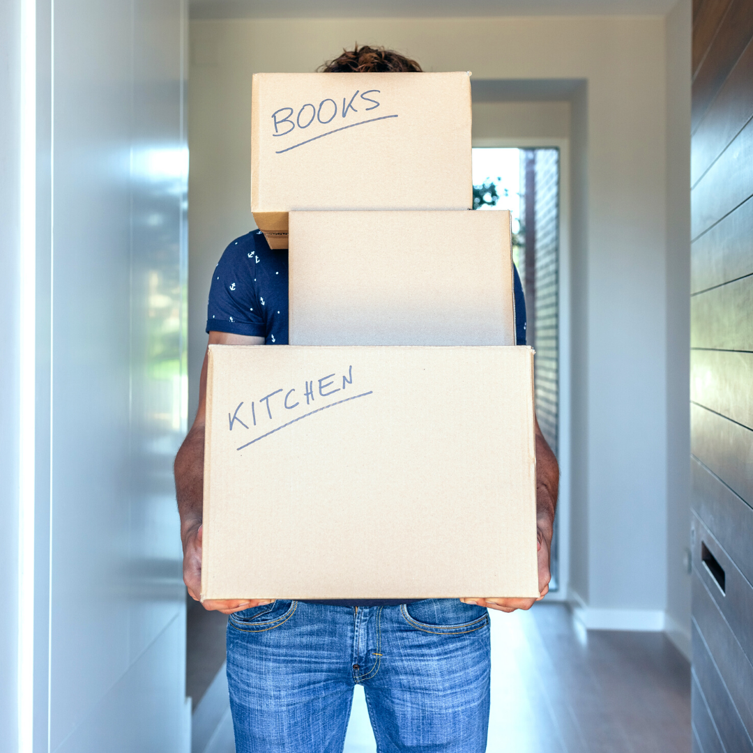 man holding his moving boxes