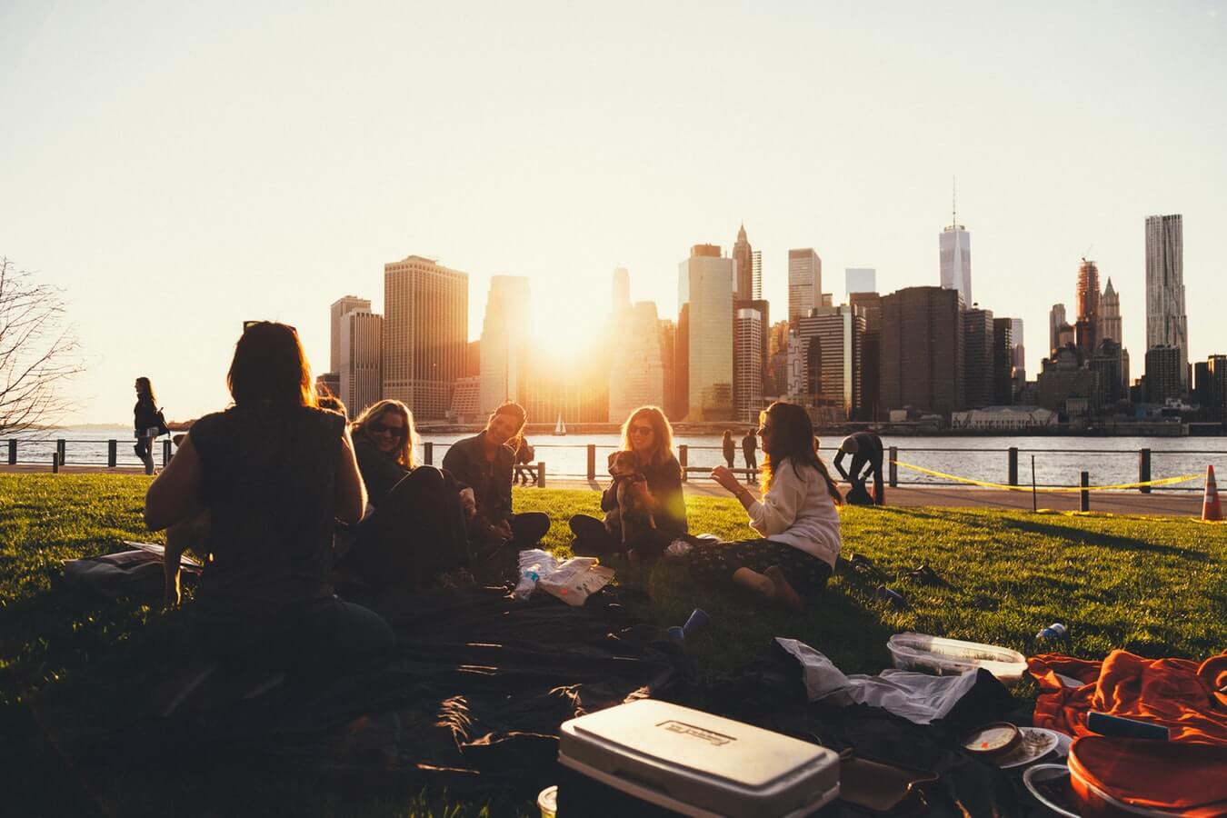 students having a picnic overlooking the sunset