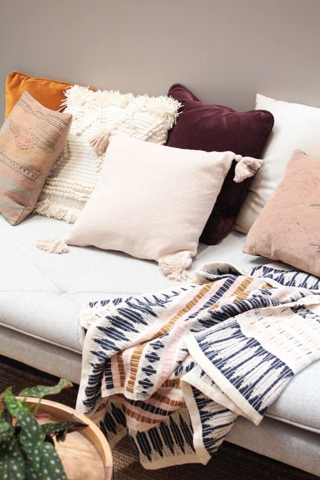 pillows and blanket on a couch